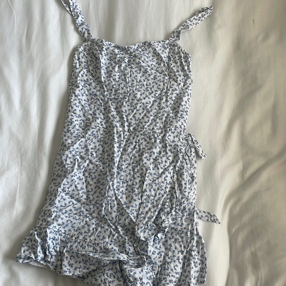 White romper with blue flowers